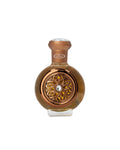 Bronze-colored perfume bottle with intricate design on a white background