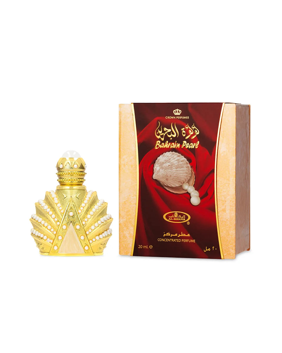 Gold perfume bottle and red and gold packaging on a white background