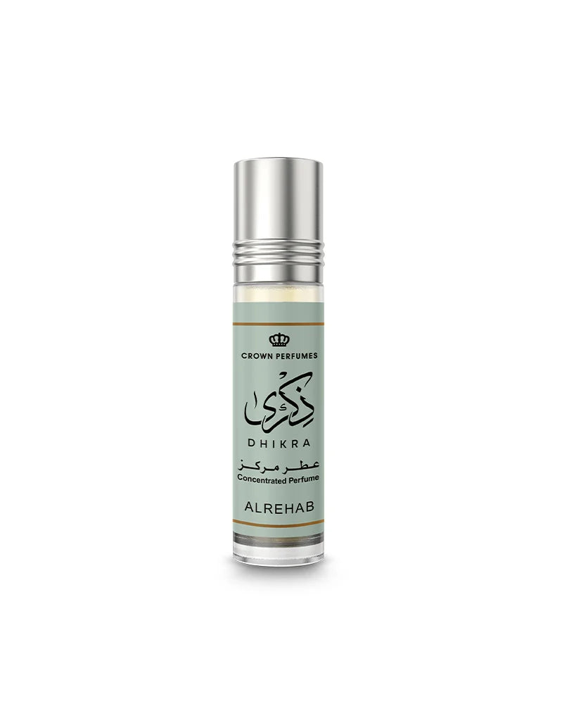 Perfume bottle labeled 'Dhikra' by Crown Perfumes on a white background