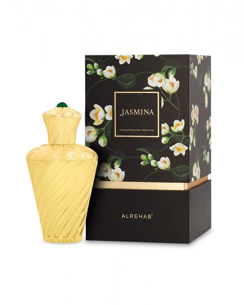 Yellow perfume bottle and black box with floral design and 'Alrehab' branding on a white background