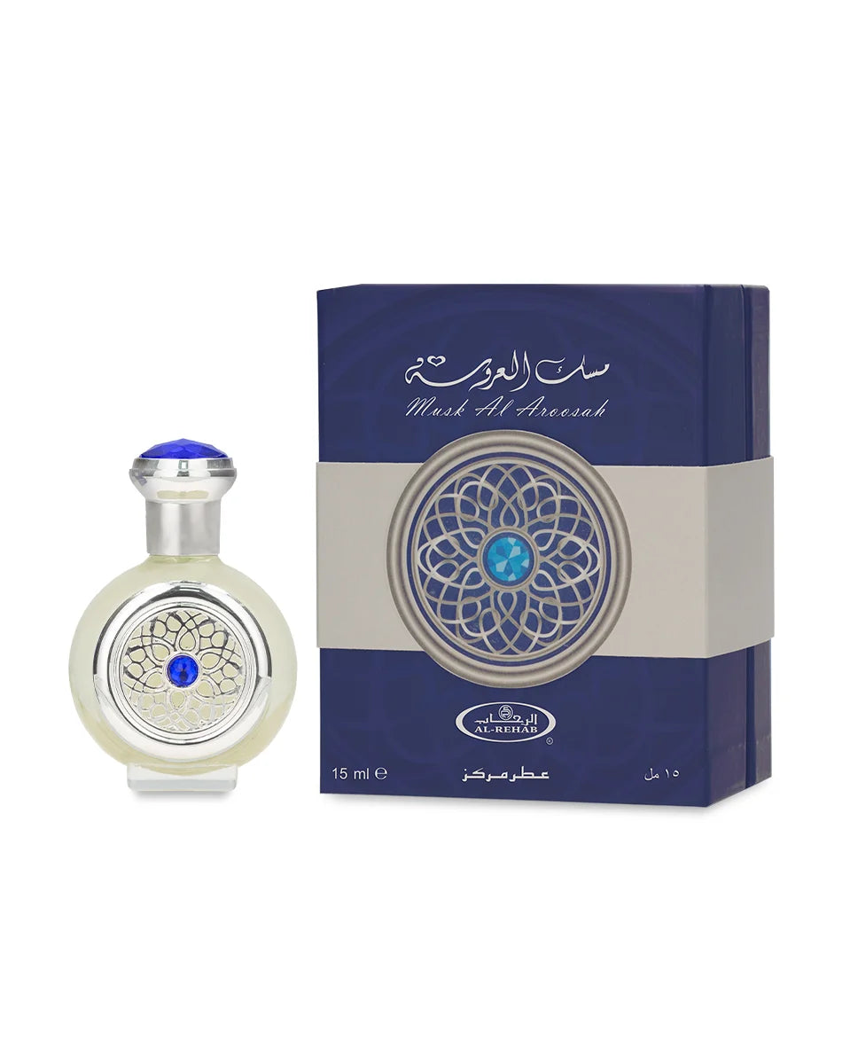 Perfume bottle and packaging with intricate design on a white background