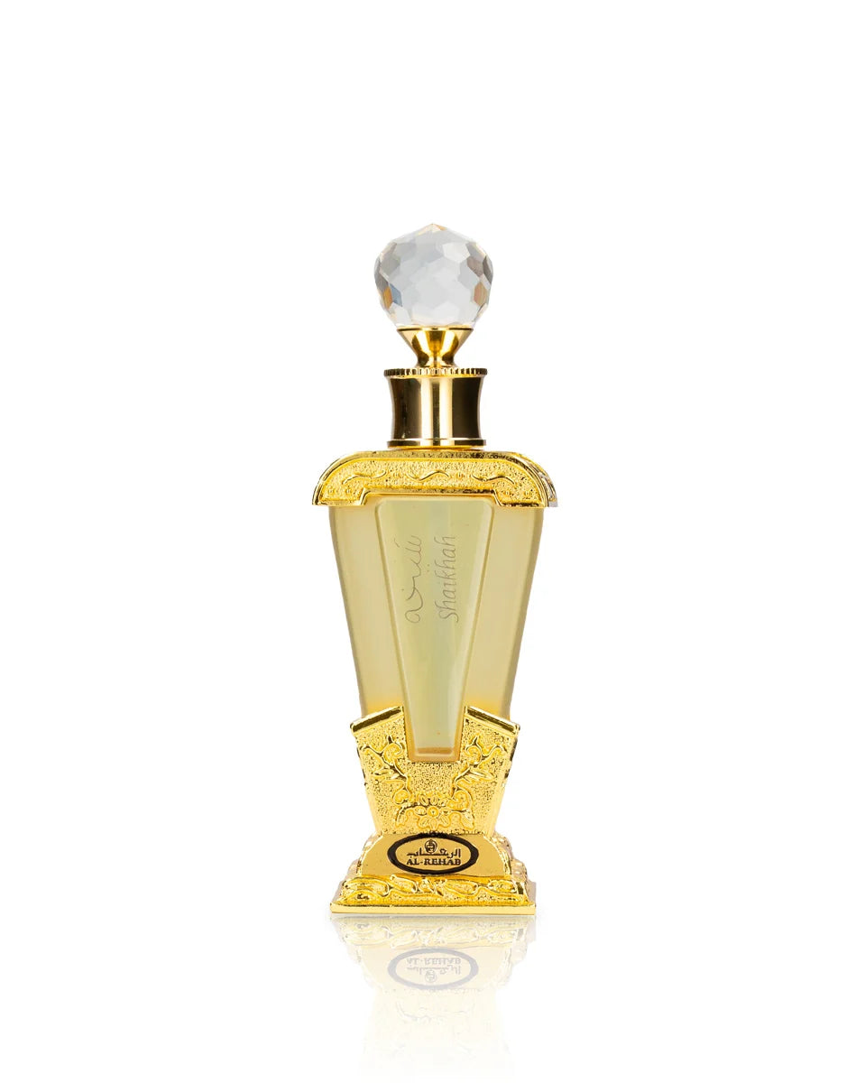 Gold perfume bottle with a white cap on a white background